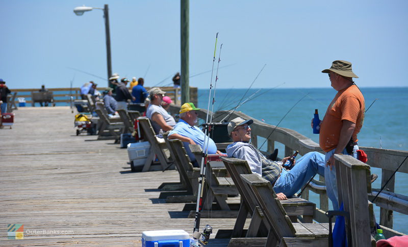Relaxing and fishing with a cool beverage on Avalon fishing pier