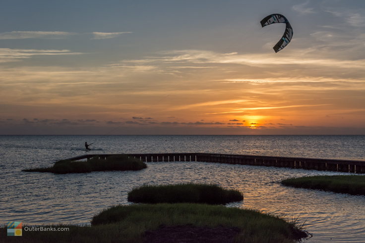 Kiteboarding in Waves at sunset