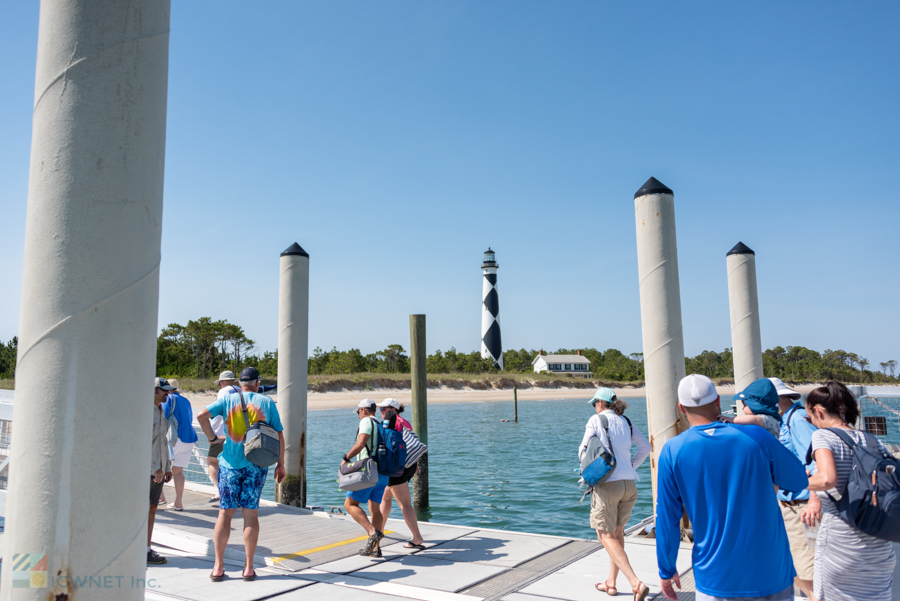Passengers leave the Island Express Ferry to visit Cape Lookout