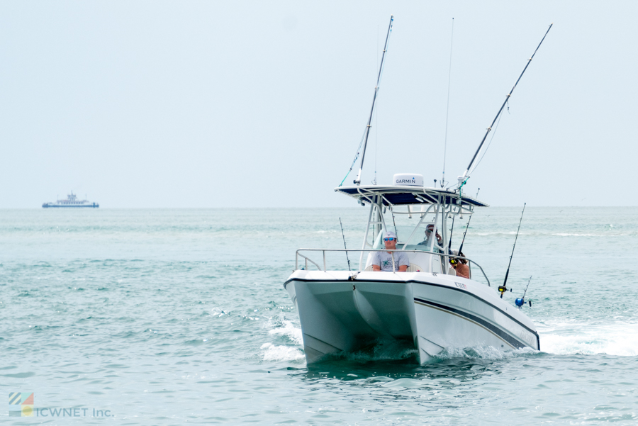 A double-hull fishing boat returns to Ocracoke