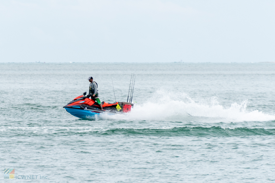 A jet ski fishing boat returns to Ocracoke