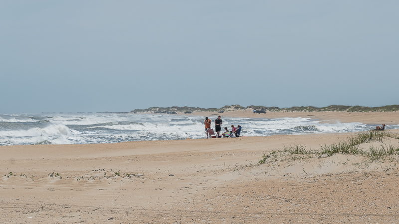 A family gathers at Old Lighthouse Beach