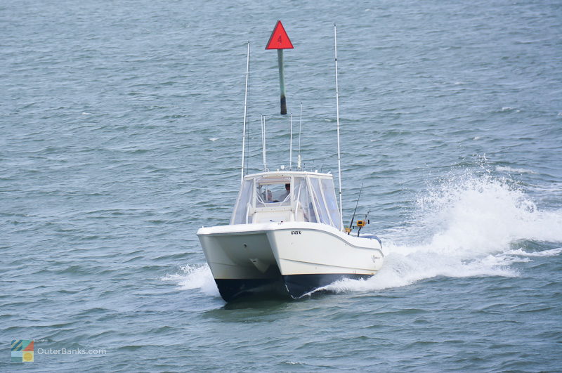 A fishing boat rides into Silver Lake in Ocracoke