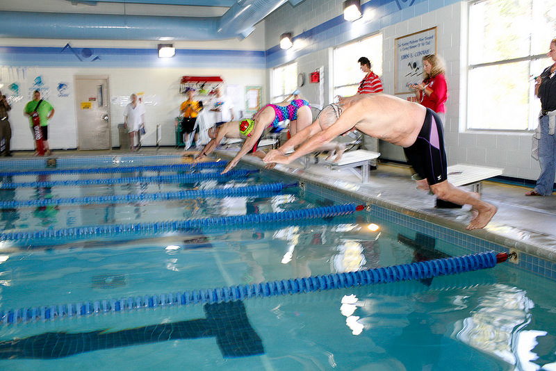 Swimmers hit the water at an indoor pool