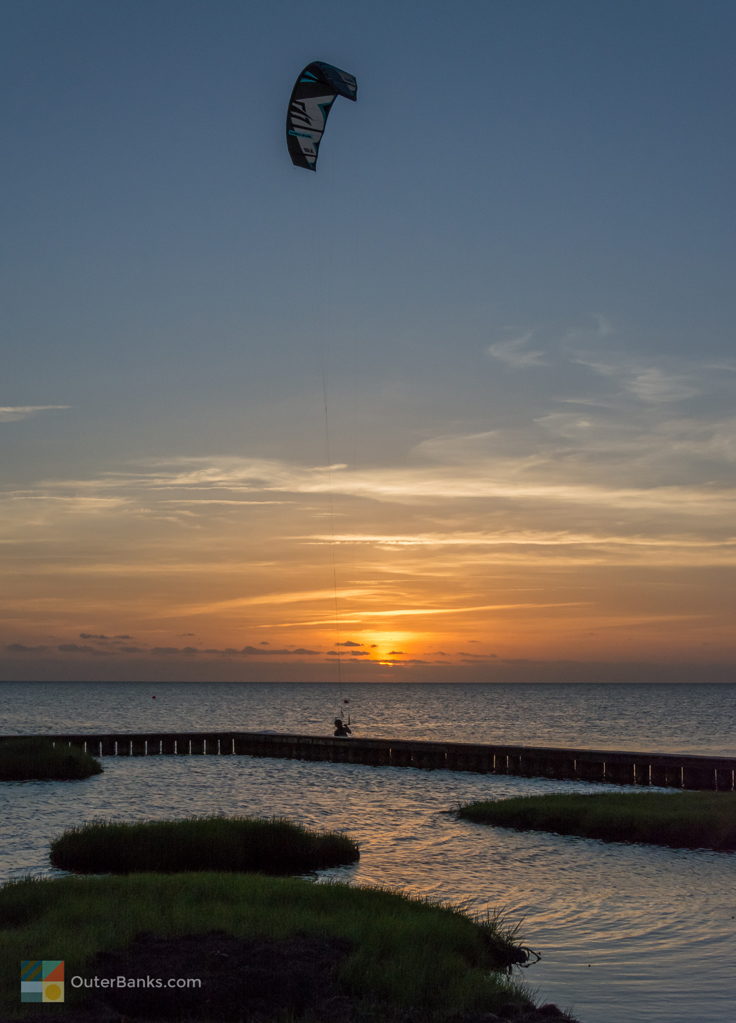 Kiteboarding in Waves at sunset