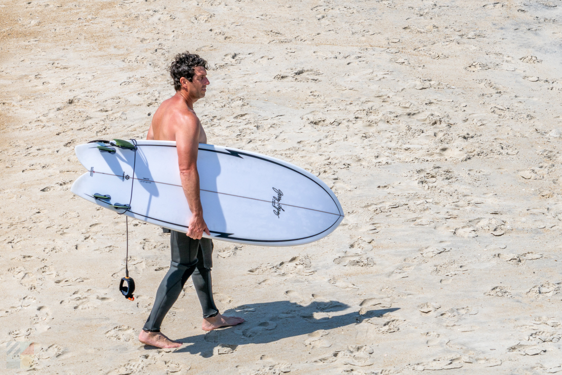 Surfer adjacent to Rodanthe Pier