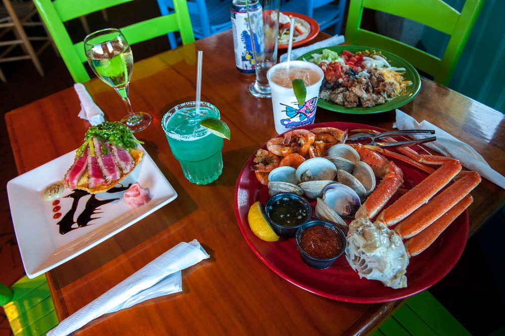 A beautiful table of food and drinks at Goombays Grill & Raw Bar