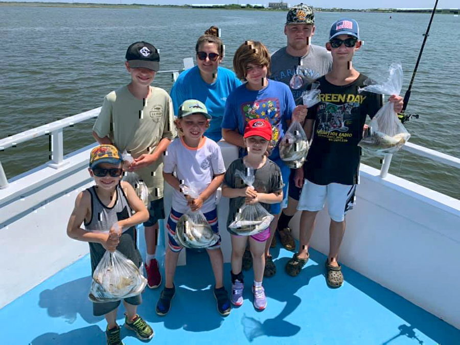 A family with their fresh catch - Miss Oregon Inlet