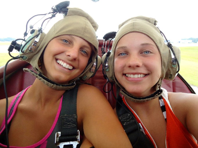 Two young riders aboard an OBX Biplane