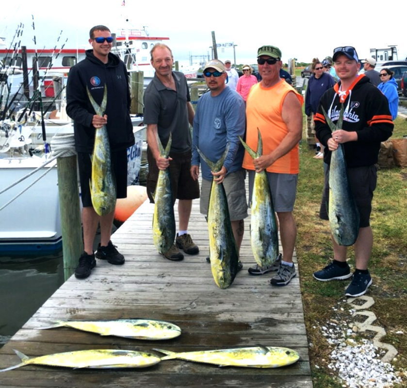 A group poses with their fresh catch at Oregon Inlet Fishing Center