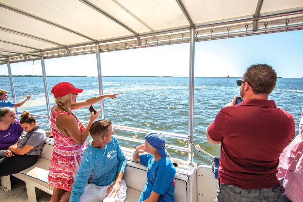 A family of passengers aboard Paradise Dolphin Cruises