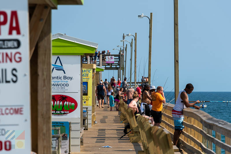 Several fishermen cast off the side of Bogue Inlet Fishing Pier