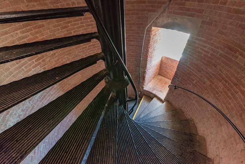 A view of the stairs and a window inside the Cape Lookout Lighthouse
