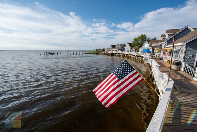 An American flag flies at the Duck Waterfront Shops