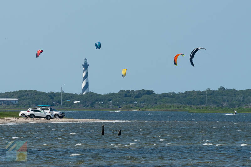 Kiteboarders in front of Cape Hatteras Lighthouse