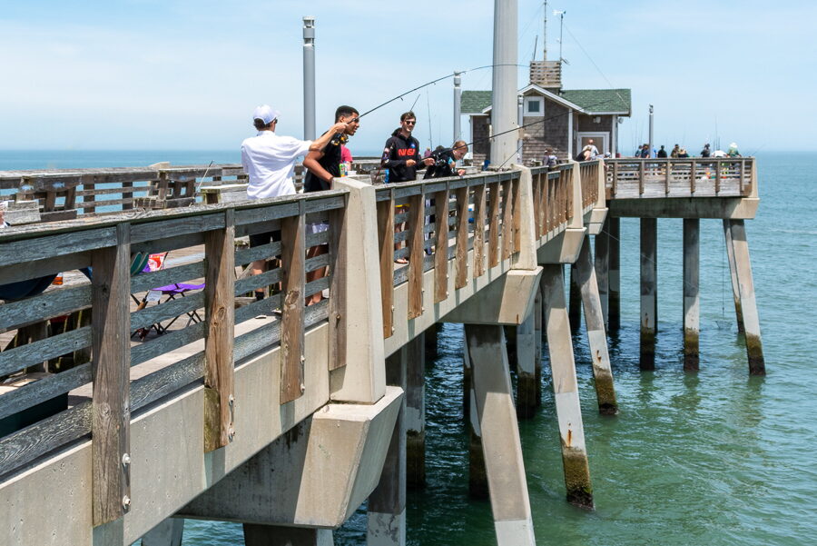 Surf fishing from the Hatteras pier on North Carolina Outer Banks